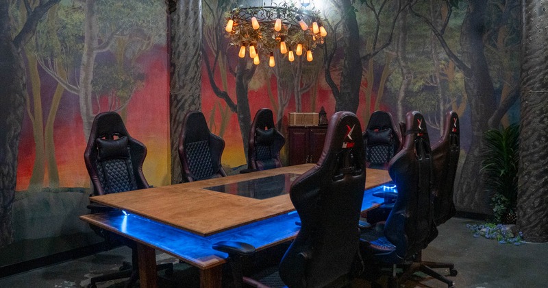 Long gaming table and gaming chairs