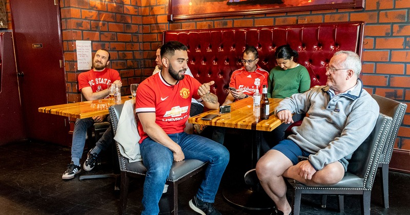 Interior, seated guests talking and enjoying drinks