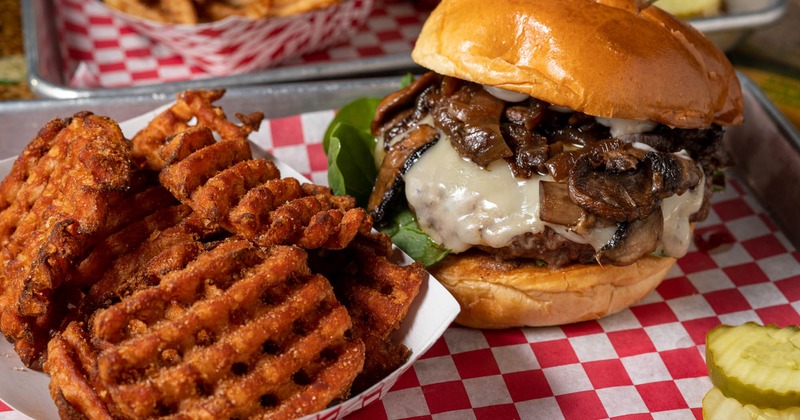 Mushroom Swiss burger and a side of sweet potato fries