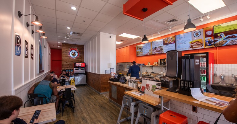 Diner area, food counter, tables, chairs, screens