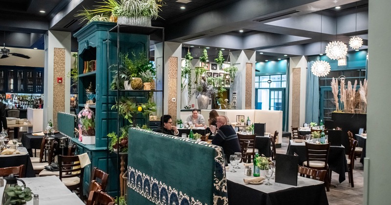 Decorated dining area, guests are enjoying