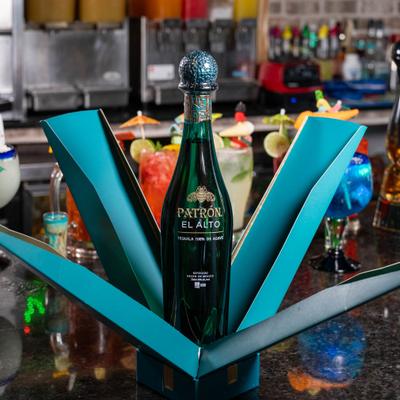 Premium tequila presented in a distinctive, open-fan display box.