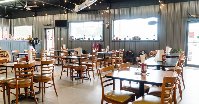Spacious interior dining area with tables ready for guests