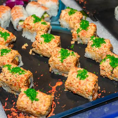 Spicy tuna on crispy rice topped with green tobiko.