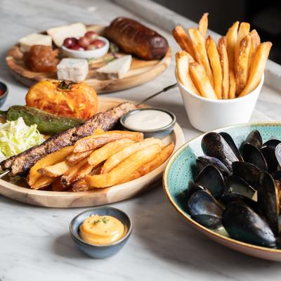 A variety of delectable cheese, grilled dry-aged meat, or premium seafood