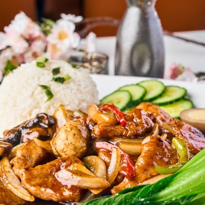 Stir fried chicken, shrimp, and beef with mushrooms, rice, and veggies.