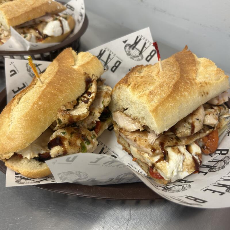 menu item 34 of 61, #9 Grilled chicken with roasted red peppers, mozz-di-bufala, and balsamic glaze on Ciabatta bread