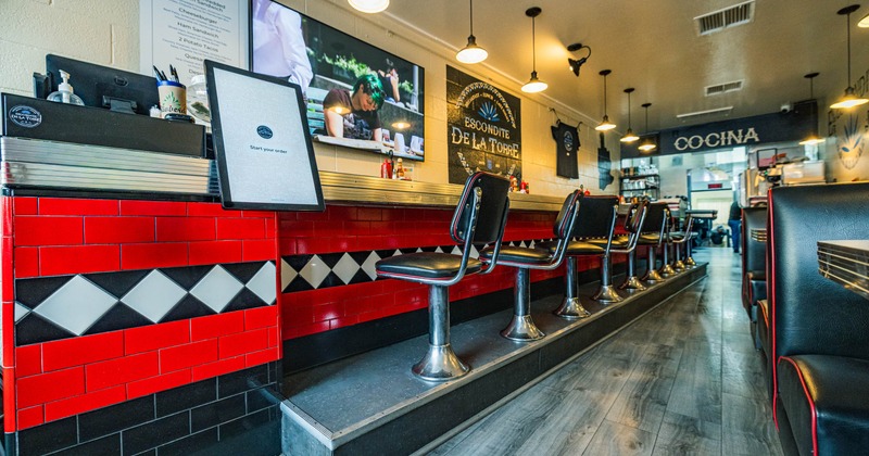 Seating area, wall counter and chairs