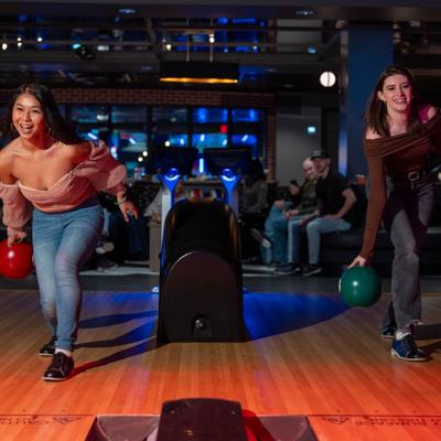 2 girls bowling.