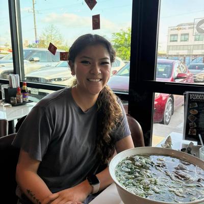 A customer with a bowl of soup.