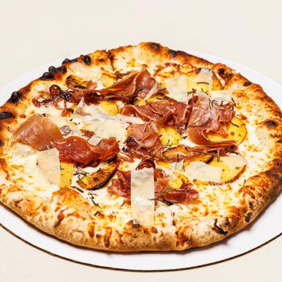 Cayuga Pizza with prosciutto, caramelized onions, mozzarella, and parmesan.