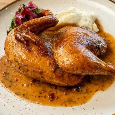 Smoked Half Chicken, with mashed potatoes, pickled onions, and sauteed greens.