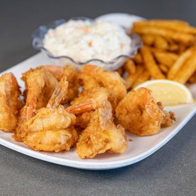 Fried shrimp dinner with sides of French fries and coleslaw.