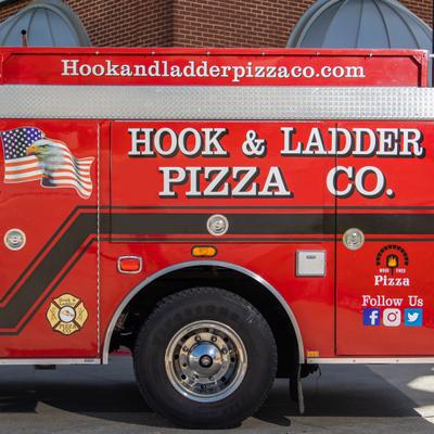 Hook and Ladder Pizza Co logo on a red fire truck.