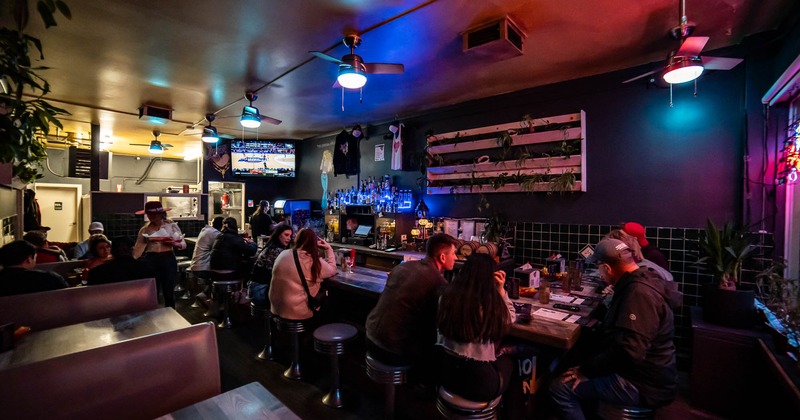 Customers sitting at the bar