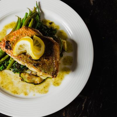 Salmon fillet, with green beans, broccoli, lemon, and zucchini