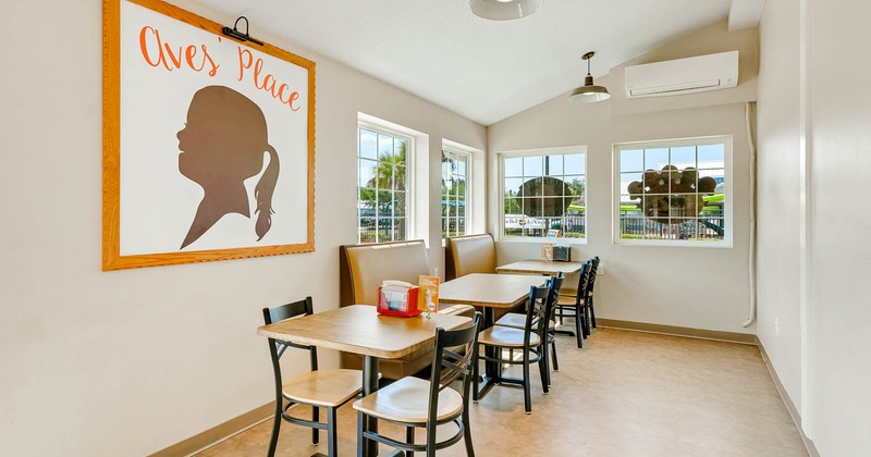 Dining area, tables for two people and seating booths