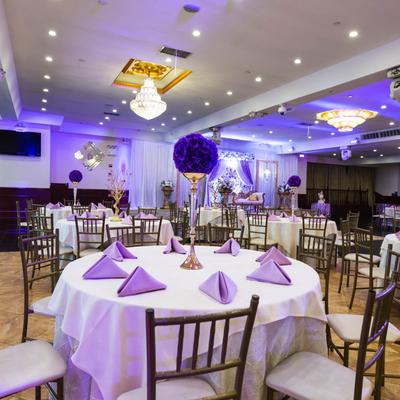 Round decorated table ready for guests