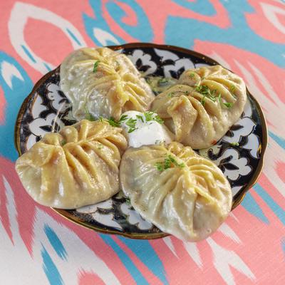 Steamed dumplings with diced beef and onions.