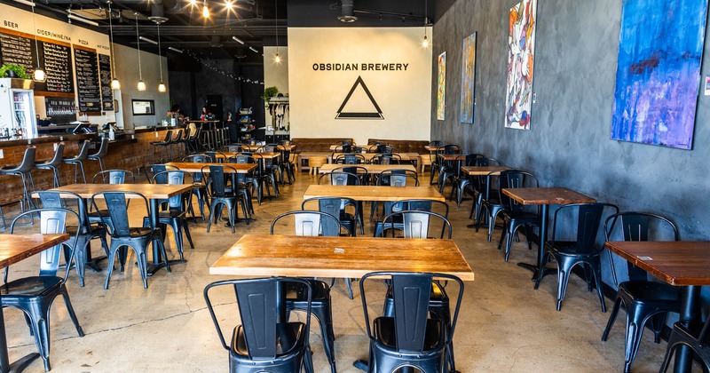 Interior seating area with chairs and tables, minimal modern decoration