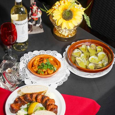 Various food and wine on the table.