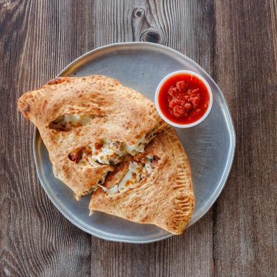 House Special Calzone served with marinara sauce.