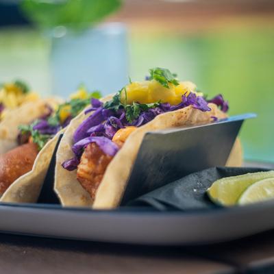 Served fish tacos at the table.