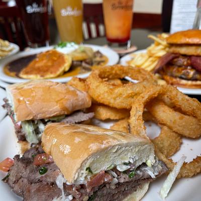 Steak sandwiches and onion rings.