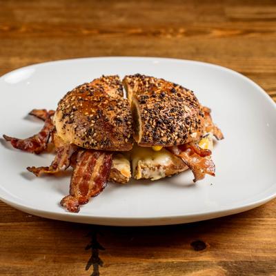Bacon, egg, and cheese sandwich on a toasted everything bagel.