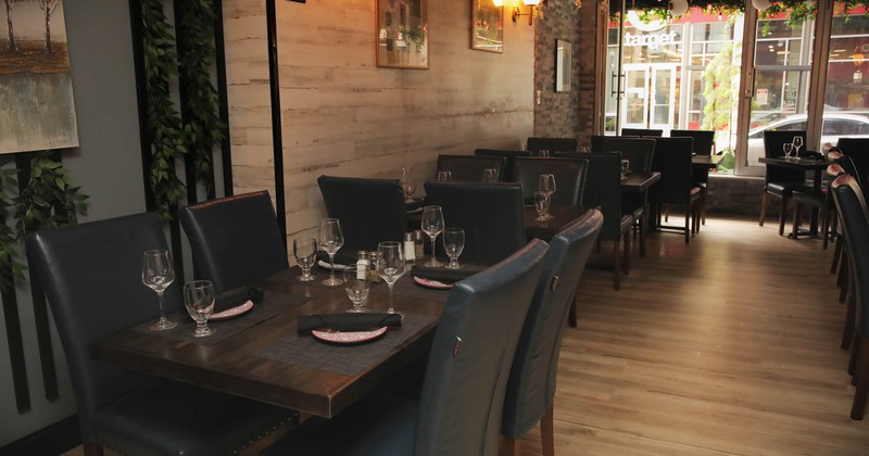 Interior, main room dining tables with leather chairs, tableware