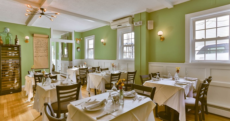 Interior, dining area, tables ready for guests