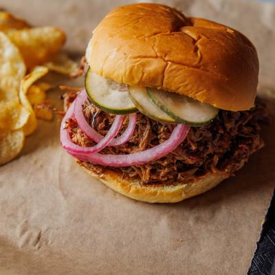 Chopped beef sandwich with chips.