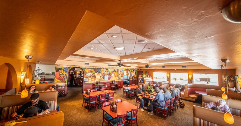 View of a dining area, guests enjoying dinner