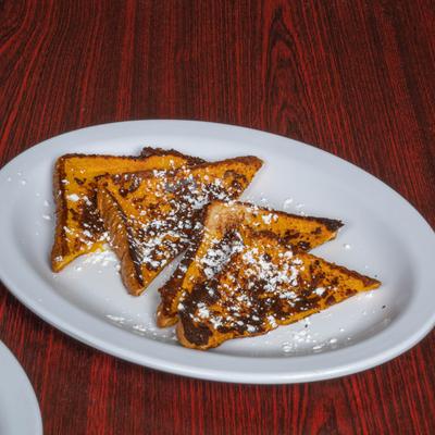 French toasts topped with powdered sugar.