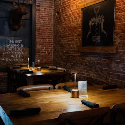 Tables with napkins and candles.