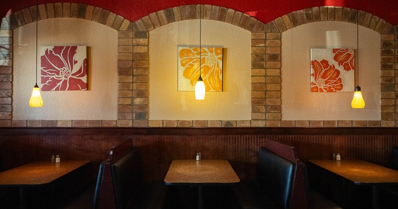 Interior, booths with decorations on the wall