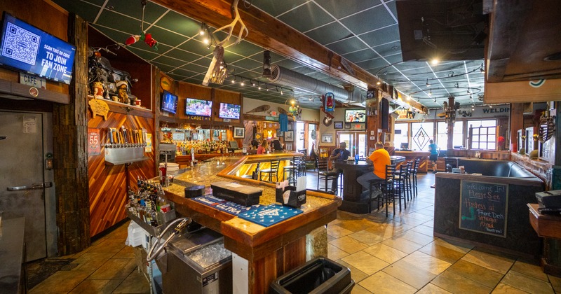 Bar, bar area, wide view from bar, tables, chairs