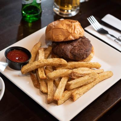 Hamburger, served with fries and ketchup.