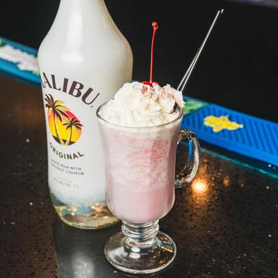 Pina Colada with a bottle of coconut liqueur.