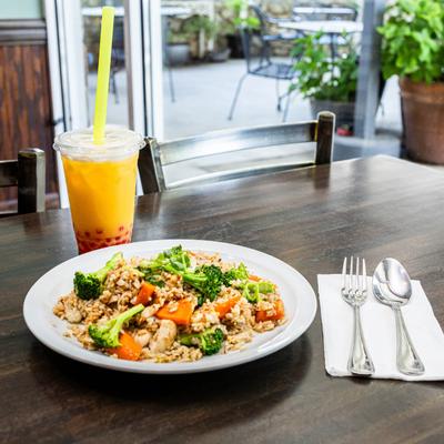 Chicken and vegetable stir-fry served with a mango bubble tea.