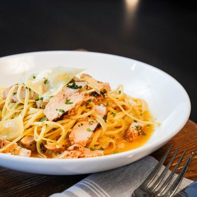 Pasta dish with chicken, served on the table.
