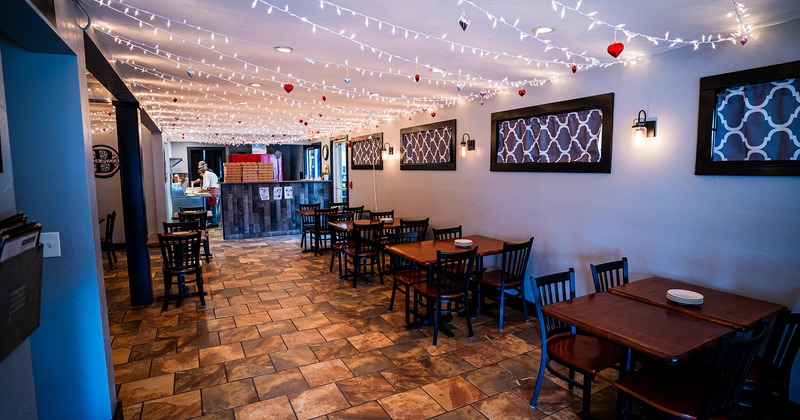 Restaurant interior, dining area, dining tables lined up