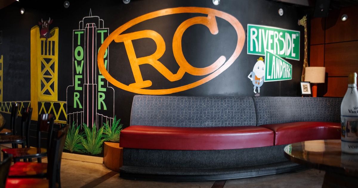 Interior, seating by a wall decorated with mural art