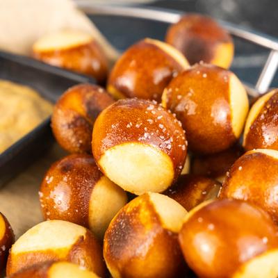 Pretzel Bites served with beer mustard dipping sauce, close-up.