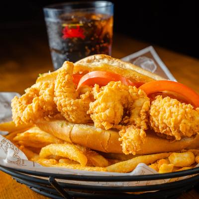 Chicken Tender Po Boy served with fries.