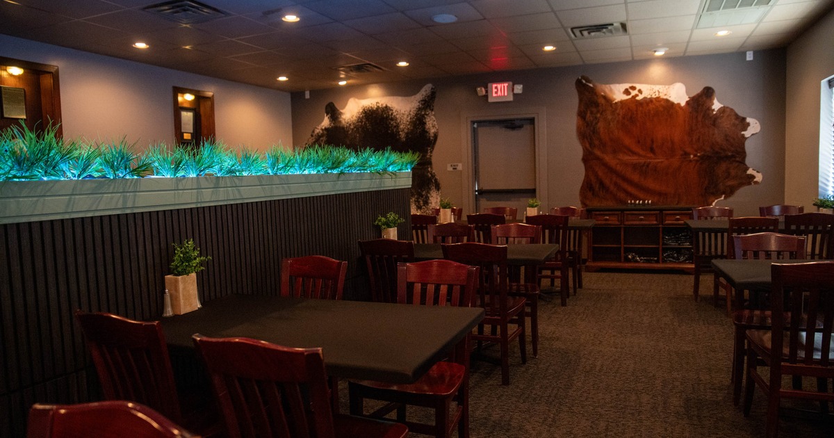 Interior, seating area with wooden tables and chairs
