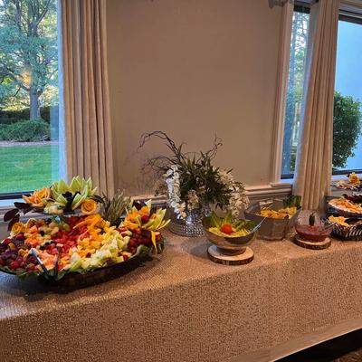 Interior, a table with flowers, Fresh fruit, and catering food on it
