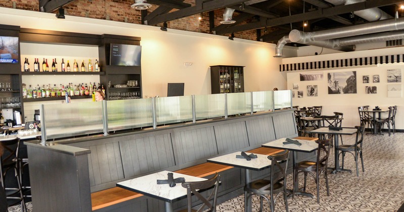 Interior, tables, chairs and wooden benches ready for guests