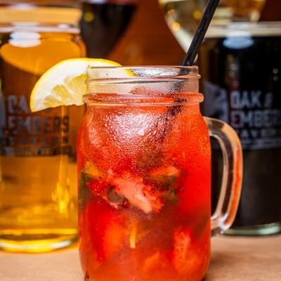 Strawberry Mojito, with assorted drinks in the background.