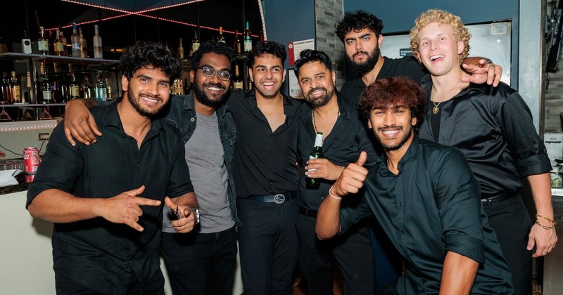 Guests posing in bar area